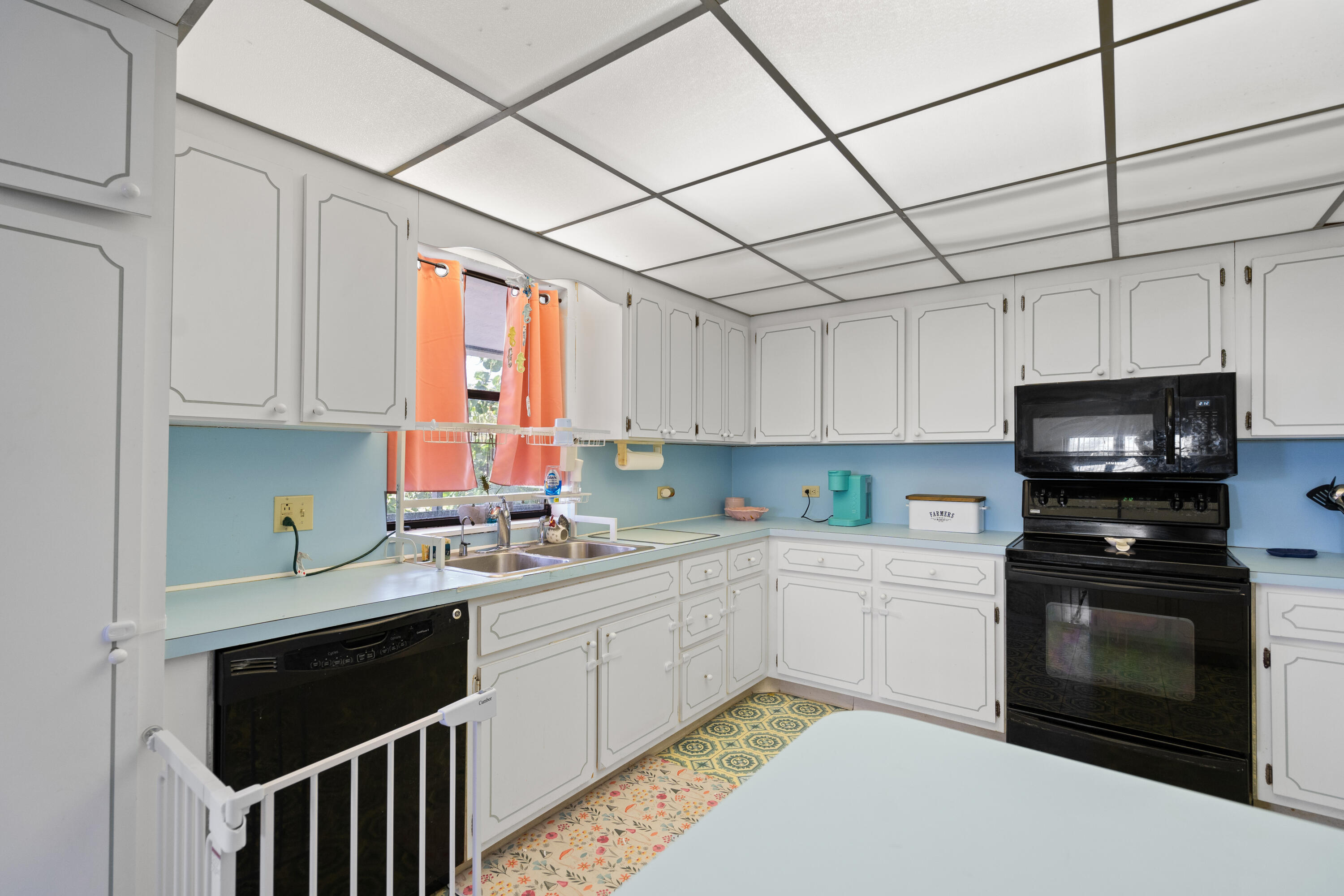 778 Canal Street Key Largo, FL 33037 - Photo 18 of 34 a kitchen with a sink a stove and cabinets