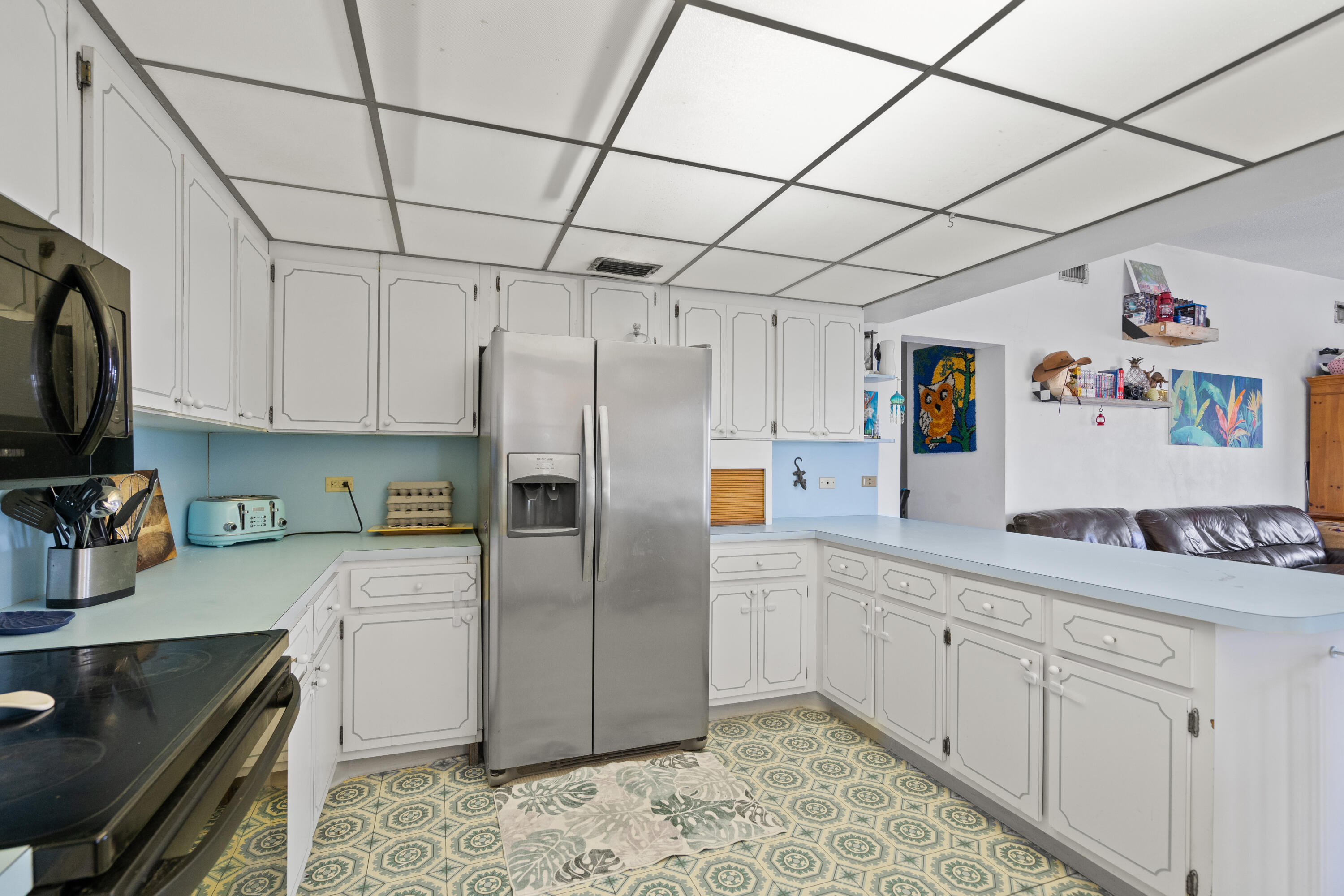 778 Canal Street Key Largo, FL 33037 - Photo 19 of 34 a kitchen with stainless steel appliances a refrigerator sink and cabinets