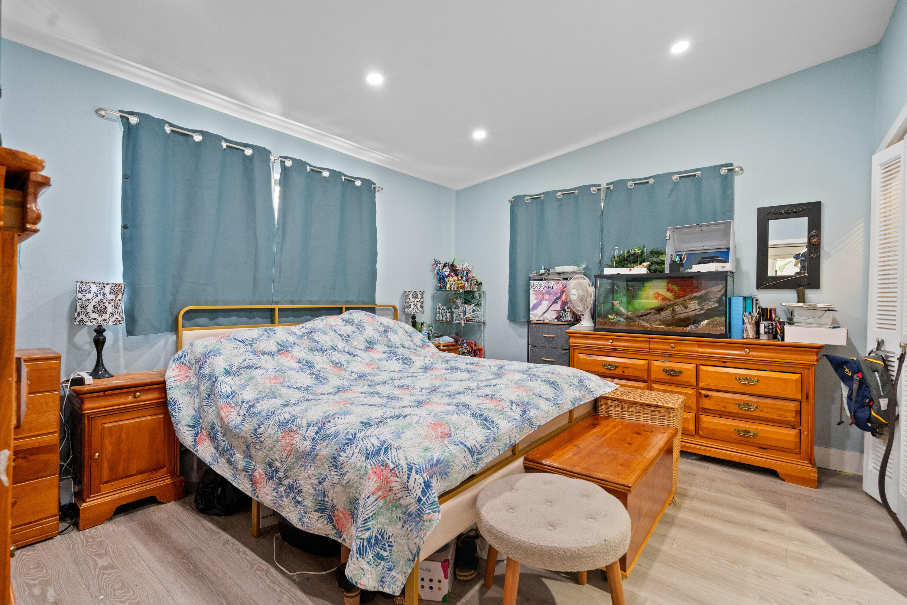 778 Canal Street Key Largo, FL 33037 - Photo 21 of 34 a bedroom with a bed and dresser with mirror