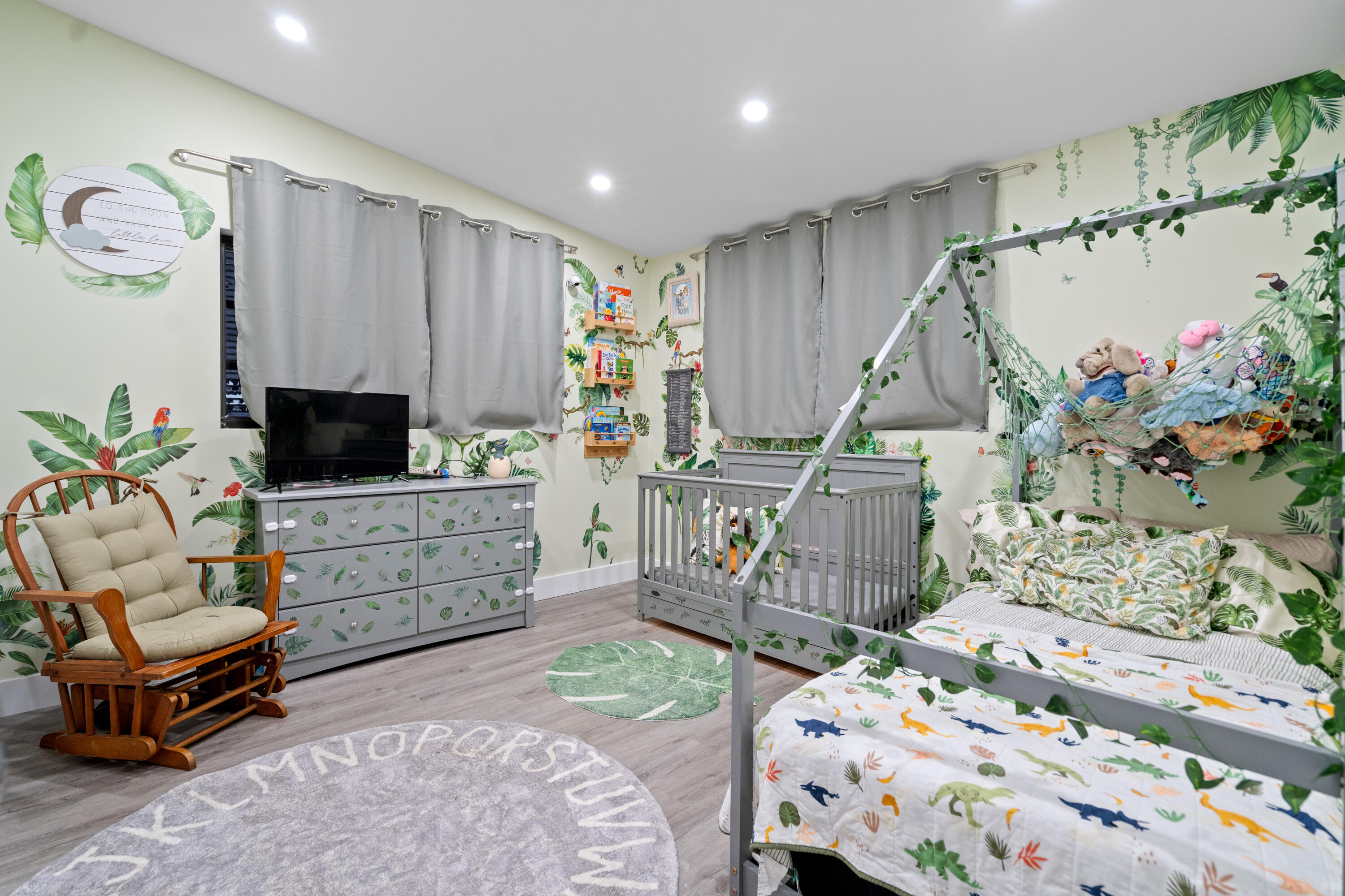 778 Canal Street Key Largo, FL 33037 - Photo 25 of 34 a bedroom with furniture and a flat screen tv