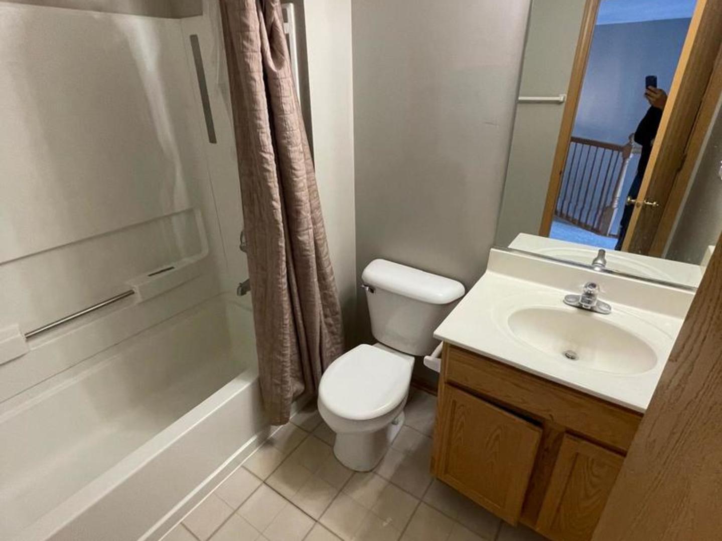 458 Landmark Avenue, Unit 458 Yorkville, IL 60560 - Photo 12 of 19 a bathroom with a sink toilet and shower