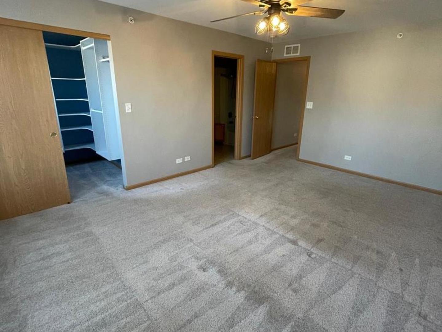 458 Landmark Avenue, Unit 458 Yorkville, IL 60560 - Photo 14 of 19 an empty room with closet and entryway