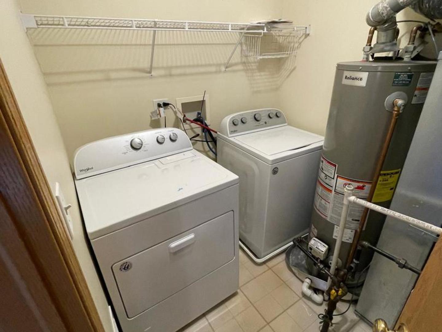 458 Landmark Avenue, Unit 458 Yorkville, IL 60560 - Photo 19 of 19 a utility room with dryer and washer