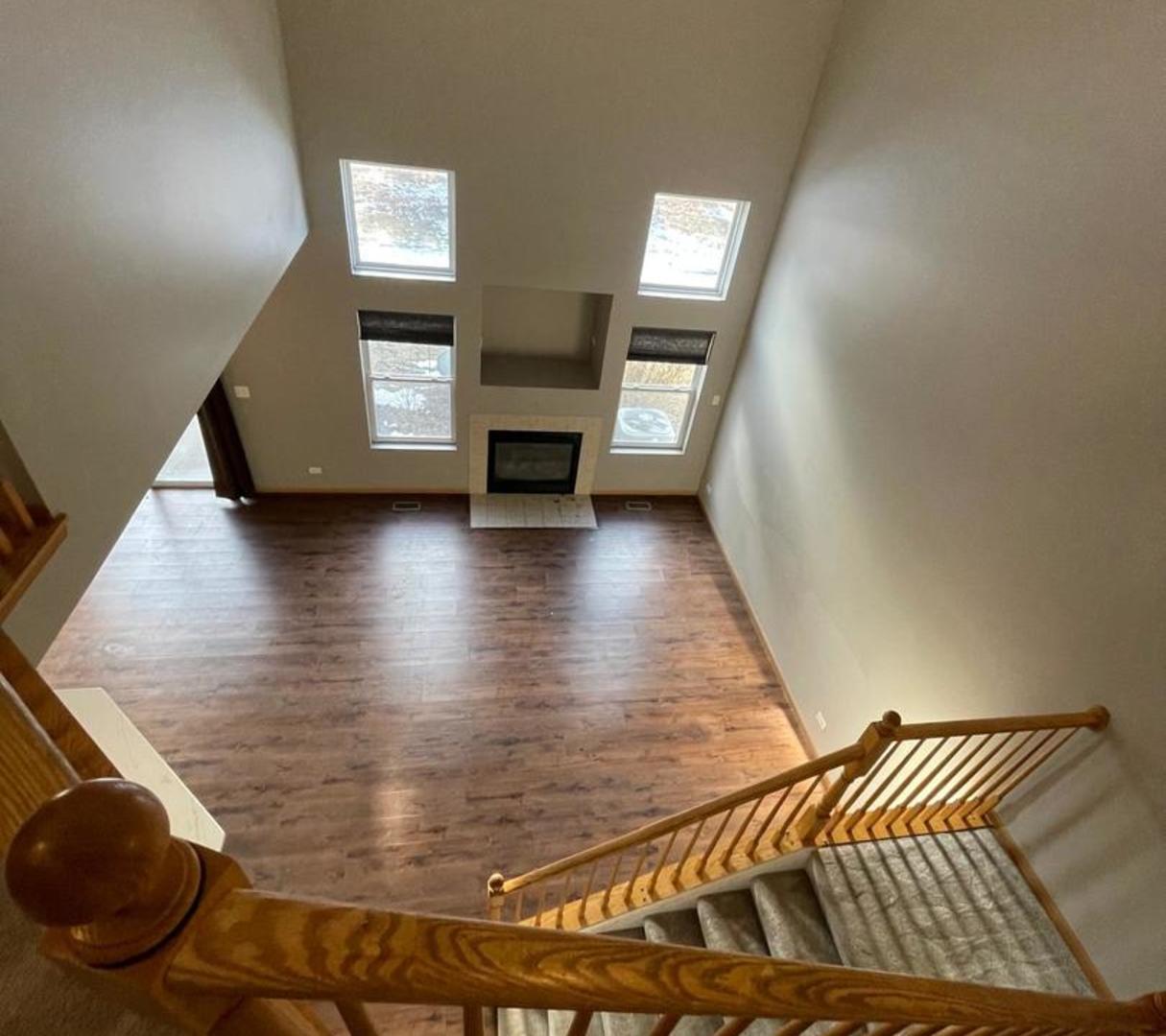 458 Landmark Avenue, Unit 458 Yorkville, IL 60560 - Photo 5 of 19 a view of livingroom with furniture and fireplace
