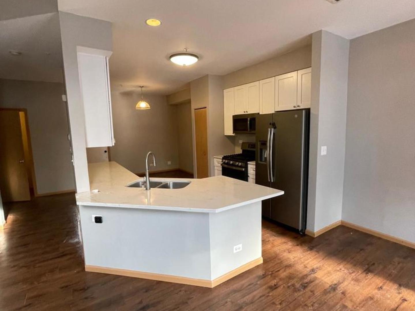 458 Landmark Avenue, Unit 458 Yorkville, IL 60560 - Photo 6 of 19 a kitchen with stainless steel appliances a refrigerator and a stove
