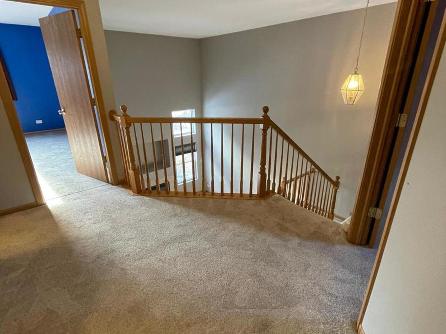 458 Landmark Avenue, Unit 458 Yorkville, IL 60560 - Photo 9 of 19 a view of a hallway with a stairs