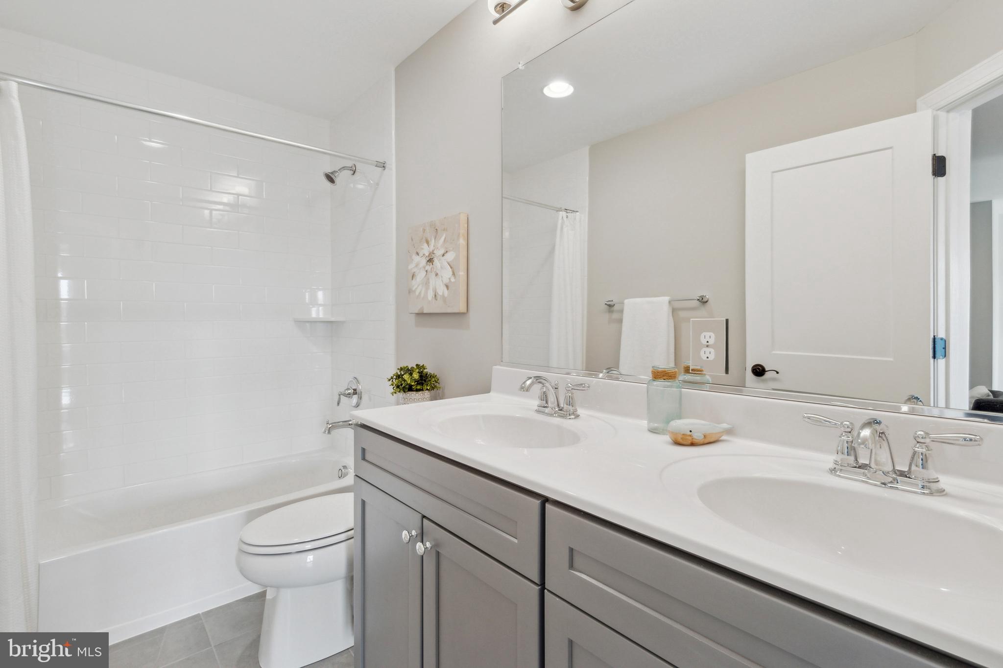 2204 Arden Drive Fallston, MD 21047 - Photo 26 of 32 a bathroom with a granite countertop sink a toilet and a bathtub