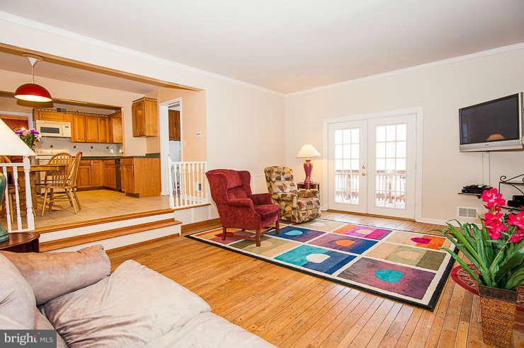 7801 Cliffside Court Springfield, VA 22153 - Photo 12 of 30 a living room with furniture and a flat screen tv