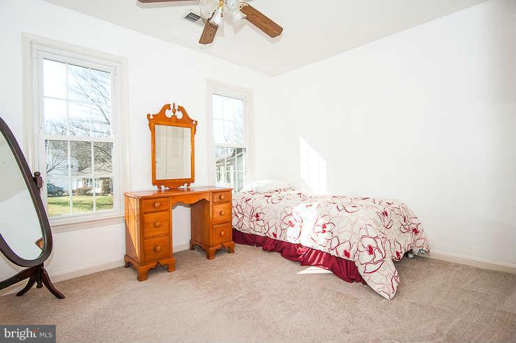 7801 Cliffside Court Springfield, VA 22153 - Photo 20 of 30 a bedroom with a bed and a window