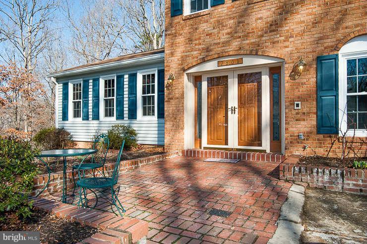 7801 Cliffside Court Springfield, VA 22153 - Photo 24 of 30 a front view of a house with outdoor seating