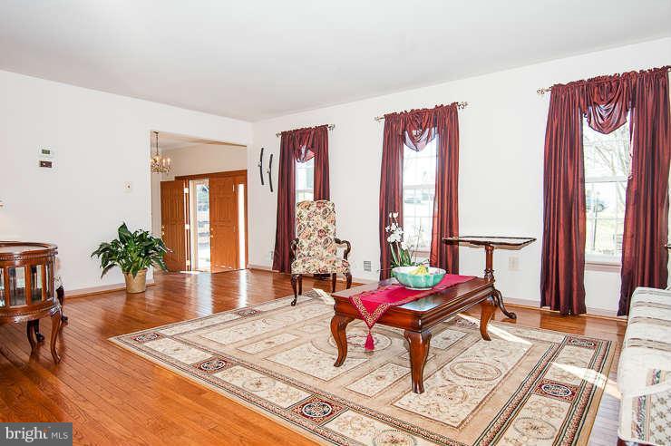 7801 Cliffside Court Springfield, VA 22153 - Photo 5 of 30 a living room with furniture and large windows