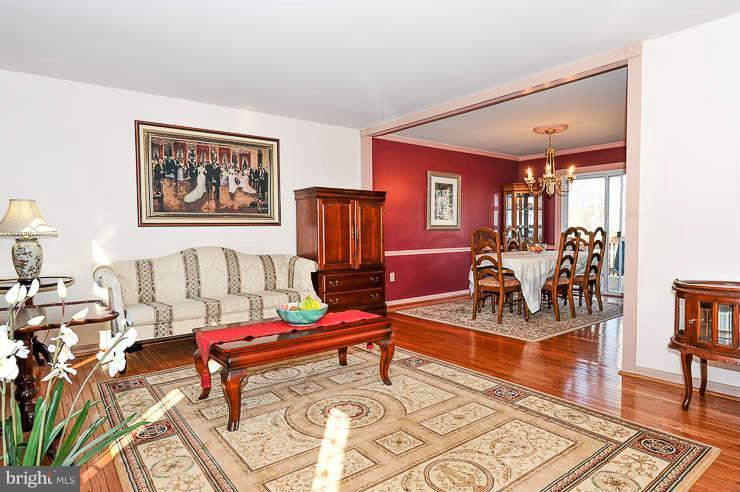 7801 Cliffside Court Springfield, VA 22153 - Photo 6 of 30 a living room with furniture a rug and a table