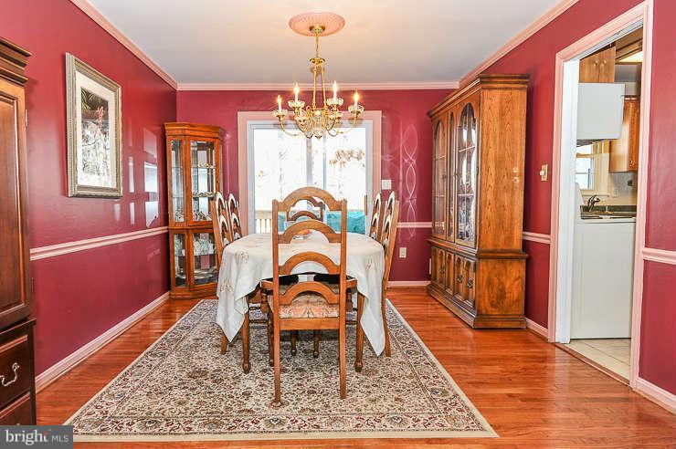 7801 Cliffside Court Springfield, VA 22153 - Photo 7 of 30 a dining room with furniture and window