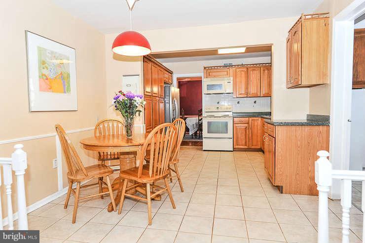7801 Cliffside Court Springfield, VA 22153 - Photo 10 of 30 a view of a dining room with furniture and a large window