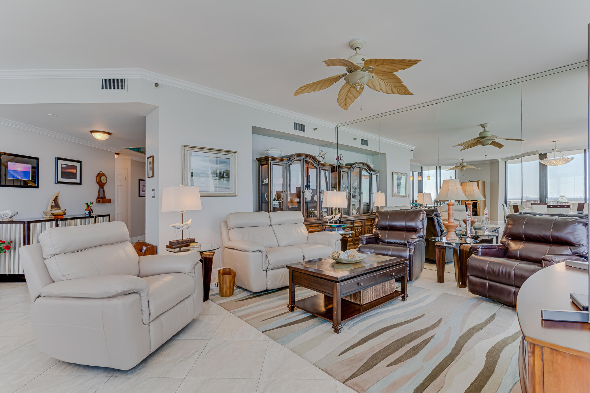 1096 Scenic Gulf Drive, Unit PH 1602 Miramar Beach, FL 32550 - Photo 15 of 80 a living room with furniture a ceiling fan and a rug