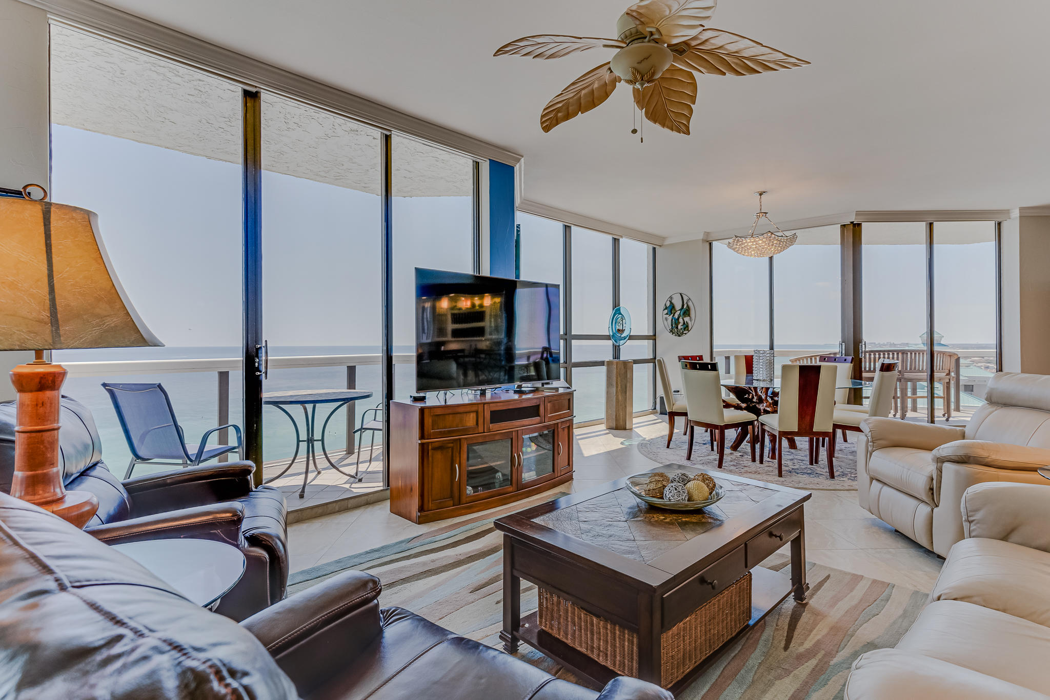 1096 Scenic Gulf Drive, Unit PH 1602 Miramar Beach, FL 32550 - Photo 16 of 80 a living room with furniture a flat screen tv and kitchen view