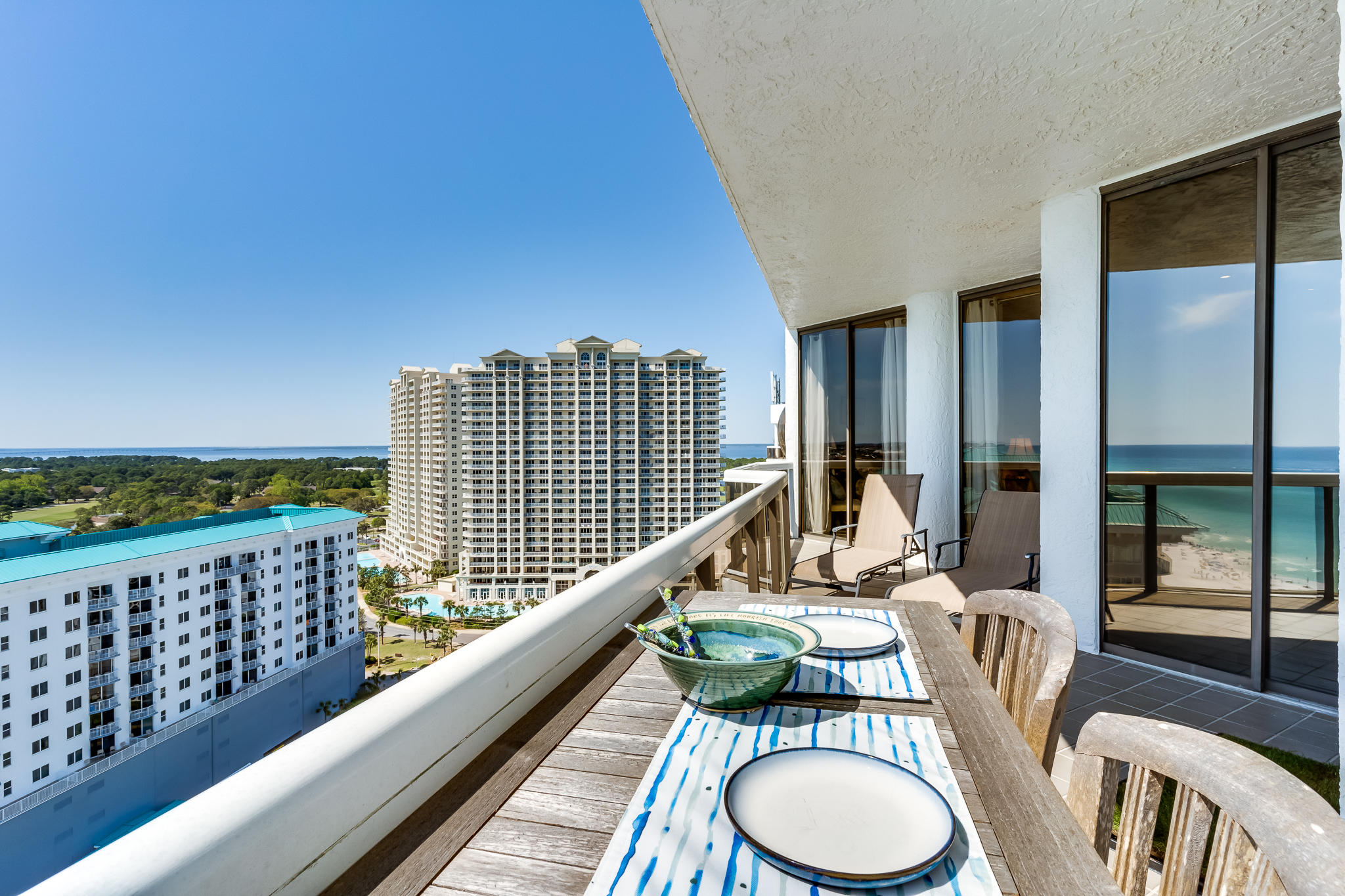 1096 Scenic Gulf Drive, Unit PH 1602 Miramar Beach, FL 32550 - Photo 24 of 80 a balcony with table and chairs