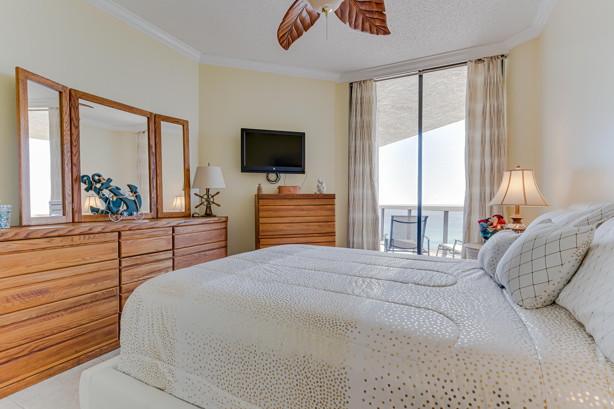 1096 Scenic Gulf Drive, Unit PH 1602 Miramar Beach, FL 32550 - Photo 37 of 80 a bedroom with a bed and a flat screen tv