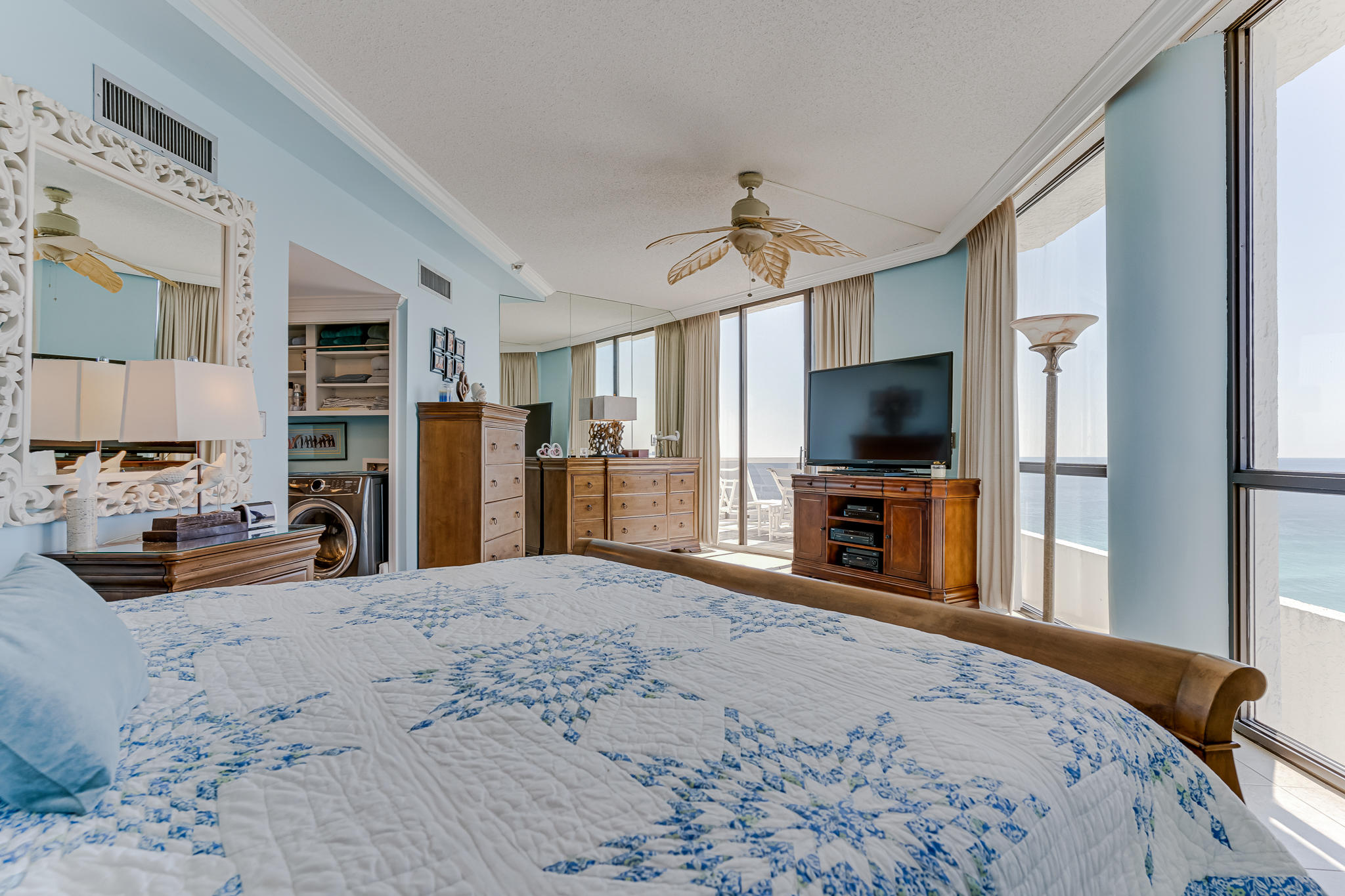 1096 Scenic Gulf Drive, Unit PH 1602 Miramar Beach, FL 32550 - Photo 48 of 80 a large bedroom with kitchen area and flat screen tv