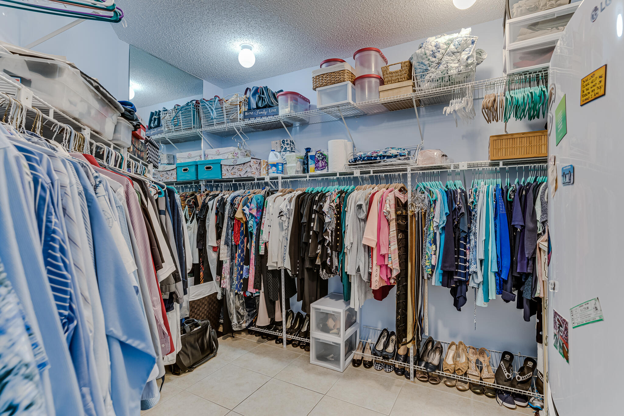 1096 Scenic Gulf Drive, Unit PH 1602 Miramar Beach, FL 32550 - Photo 58 of 80 a view of walk in closet with clothes and shoes