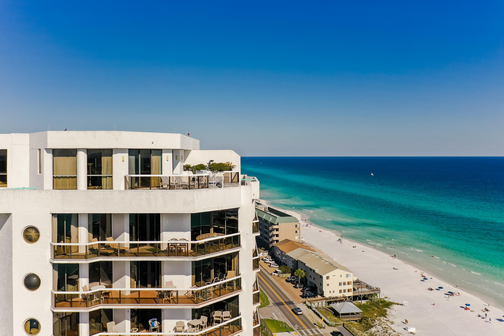 1096 Scenic Gulf Drive, Unit PH 1602 Miramar Beach, FL 32550 - Photo 65 of 80 a front view of a building with a garden