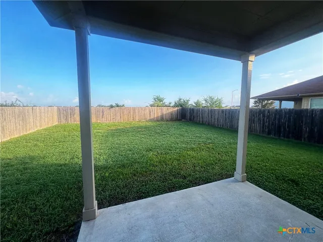 a view of a backyard with a garden