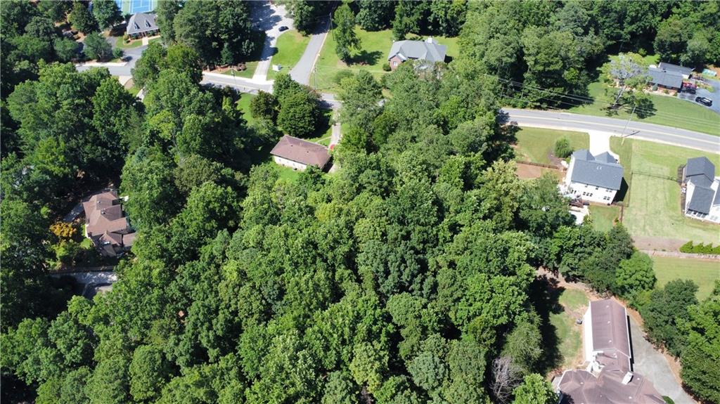 803 Chestnut Hill Road Southwest Marietta, GA 30064 - Photo 5 of 9 an aerial view of a house with a yard and lake view