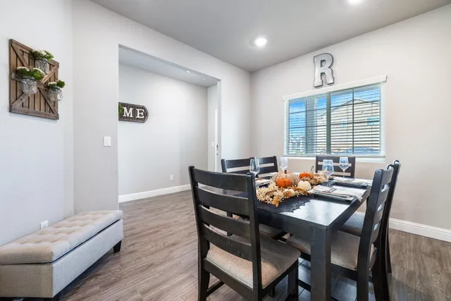 a dining room with furniture and window