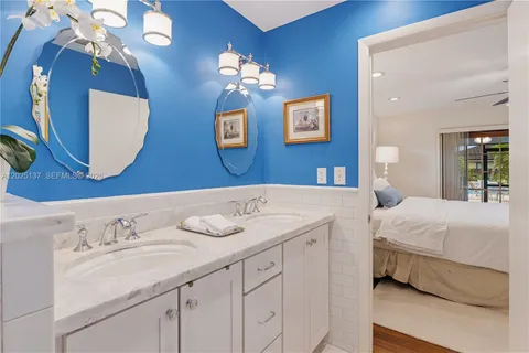 a bedroom with a bed a window and a couch