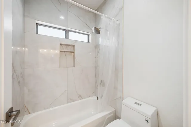 a bathroom with a sink double vanity and a mirror