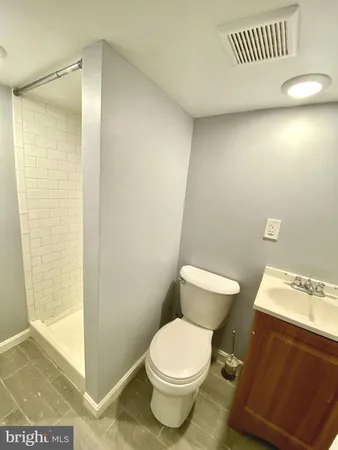 a view of a garage with rack and bicycle