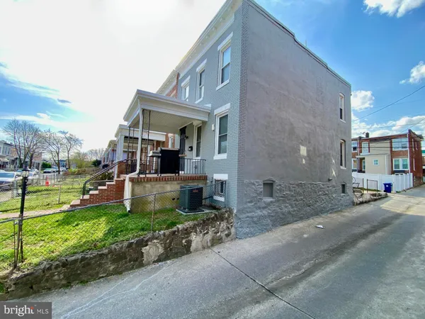 a car parked in front of a house