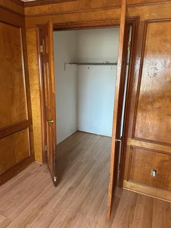 a view of front door with wooden floor