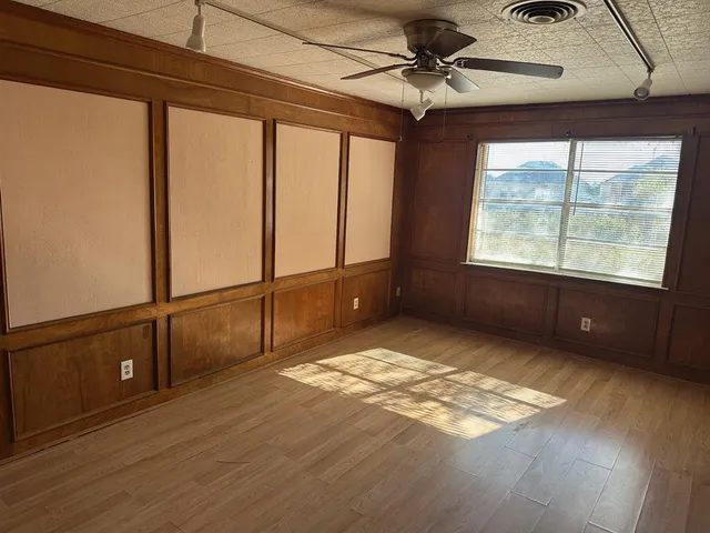 a view of an empty room and window