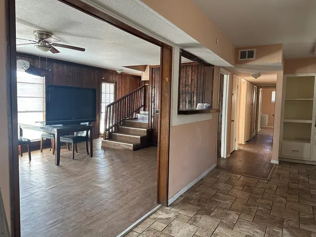 a view of a hallway view with living room and dining room