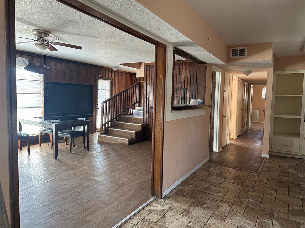 1905 Hard Rock Road Irving, TX 75061 - Photo 3 of 24 a view of a hallway view with living room and dining room