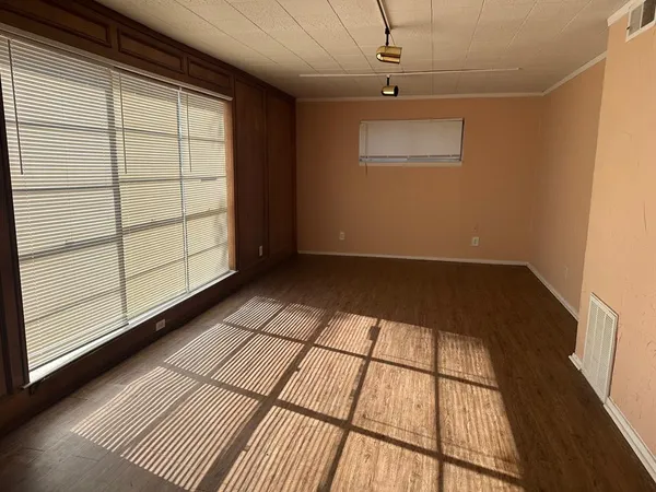 a view of empty room with windows