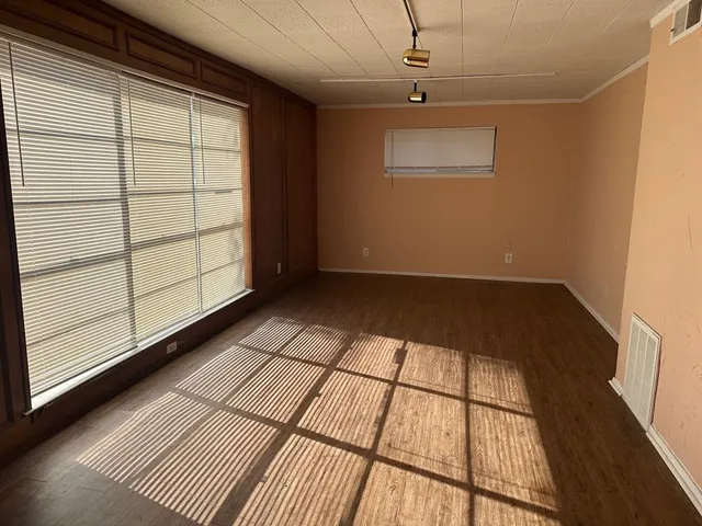 a view of empty room with windows