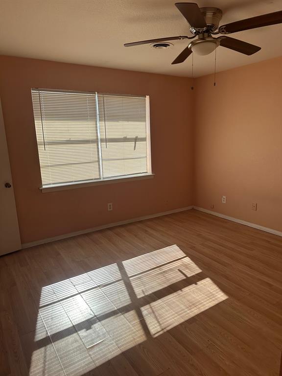 1905 Hard Rock Road Irving, TX 75061 - Photo 10 of 24 a view of a room with wooden floor and windows