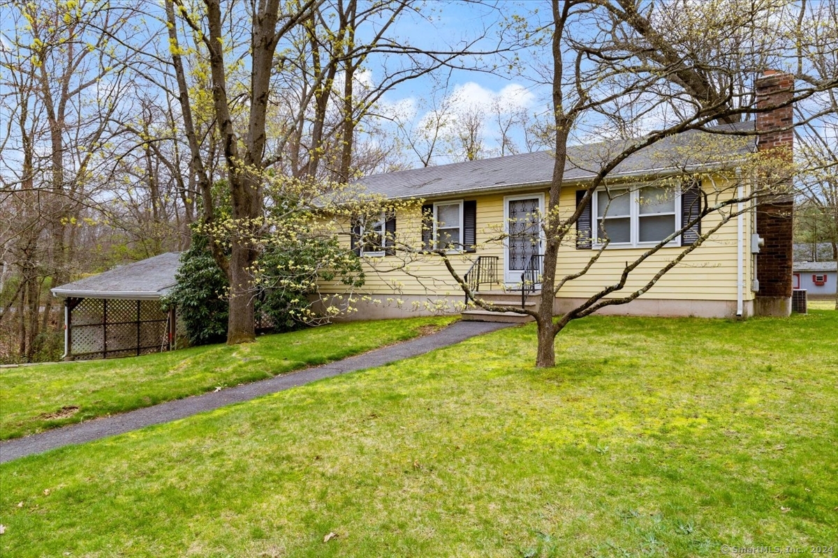 17 Spring Street Plainville, CT 06062 - Photo 1 of 1 a view of a house with a yard