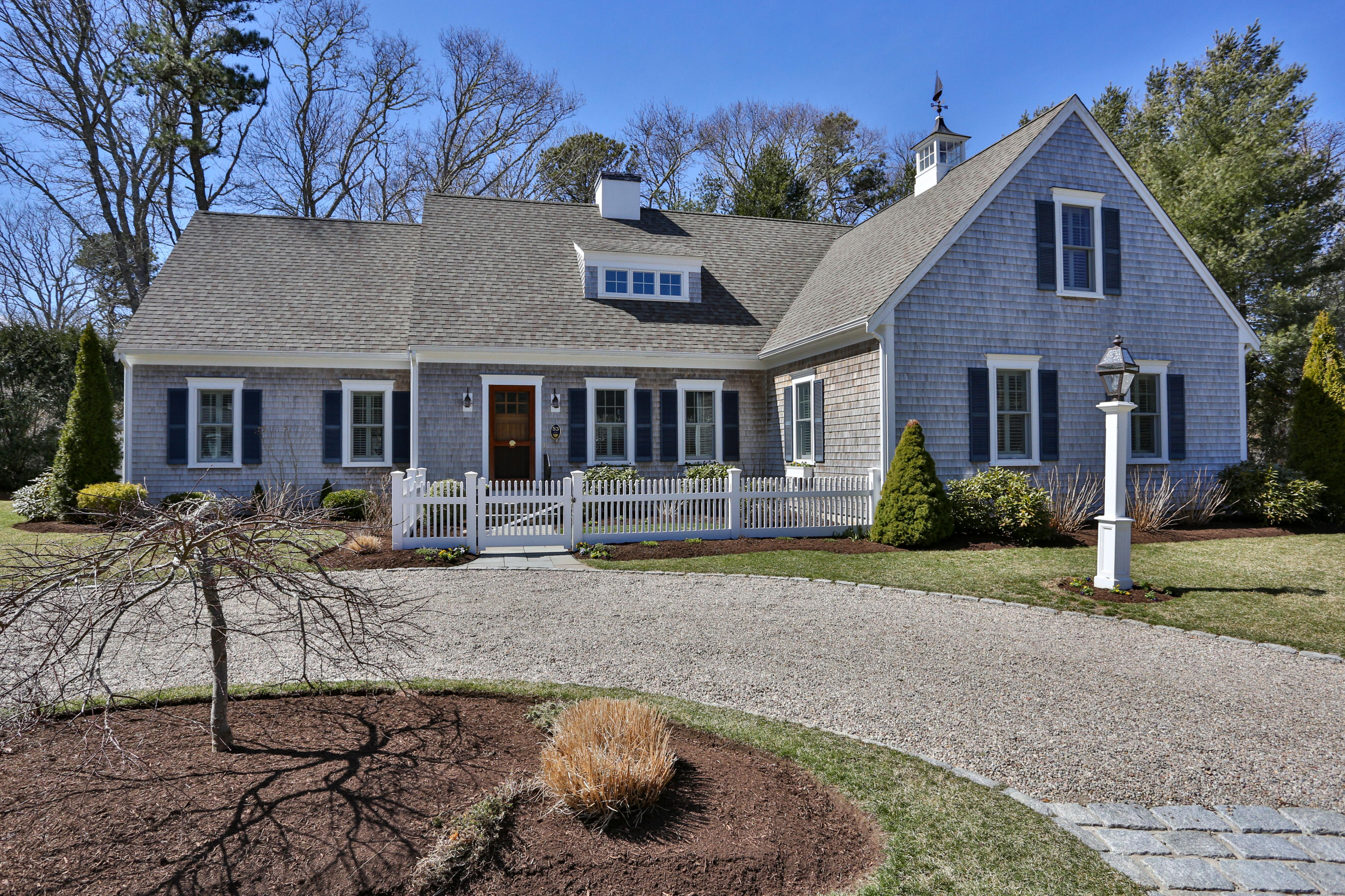 53 Blanid Road Osterville, MA 02655 - Photo 2 of 21 a front view of a house with garden