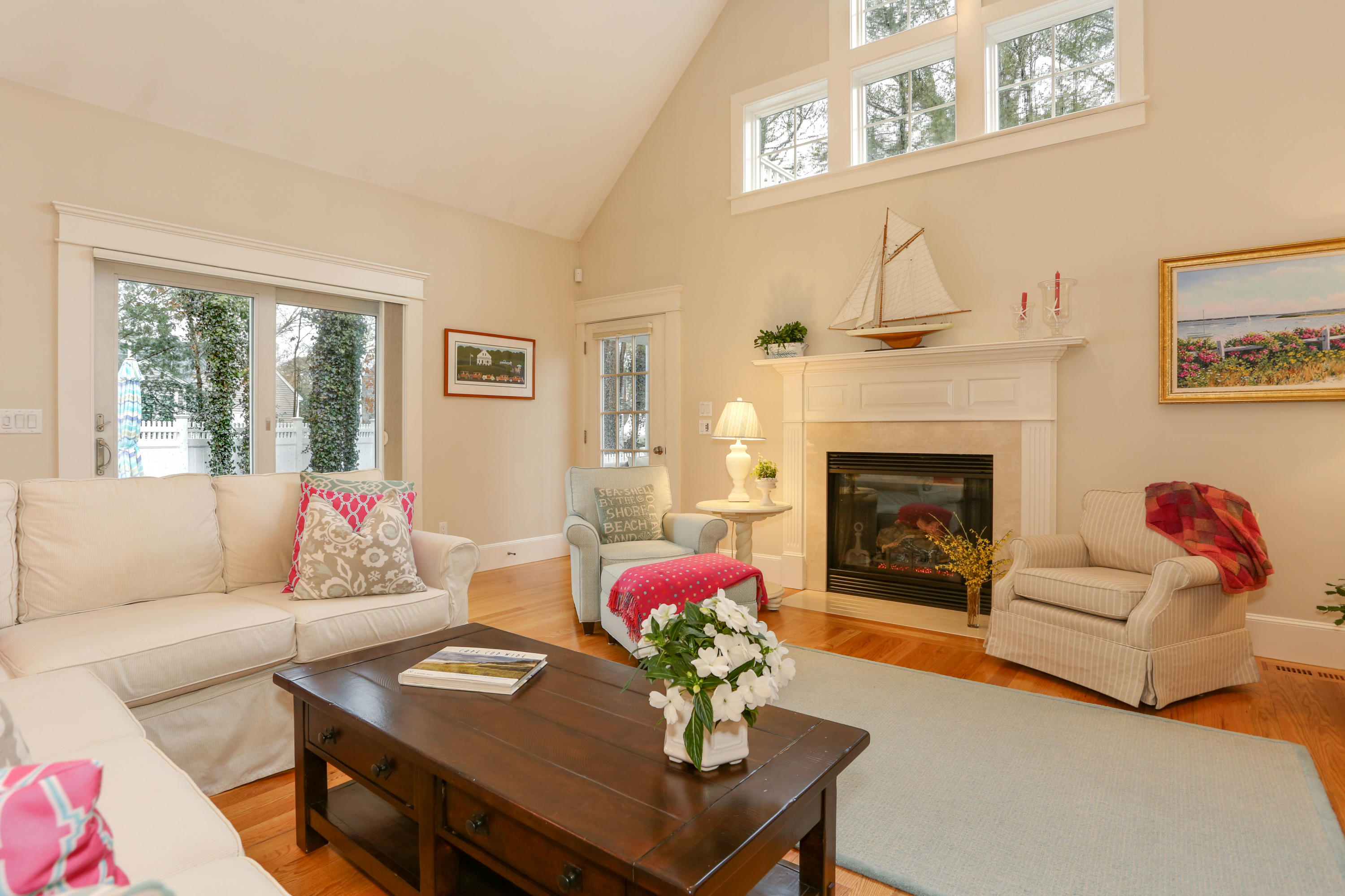 53 Blanid Road Osterville, MA 02655 - Photo 7 of 21 a living room with furniture and a fireplace