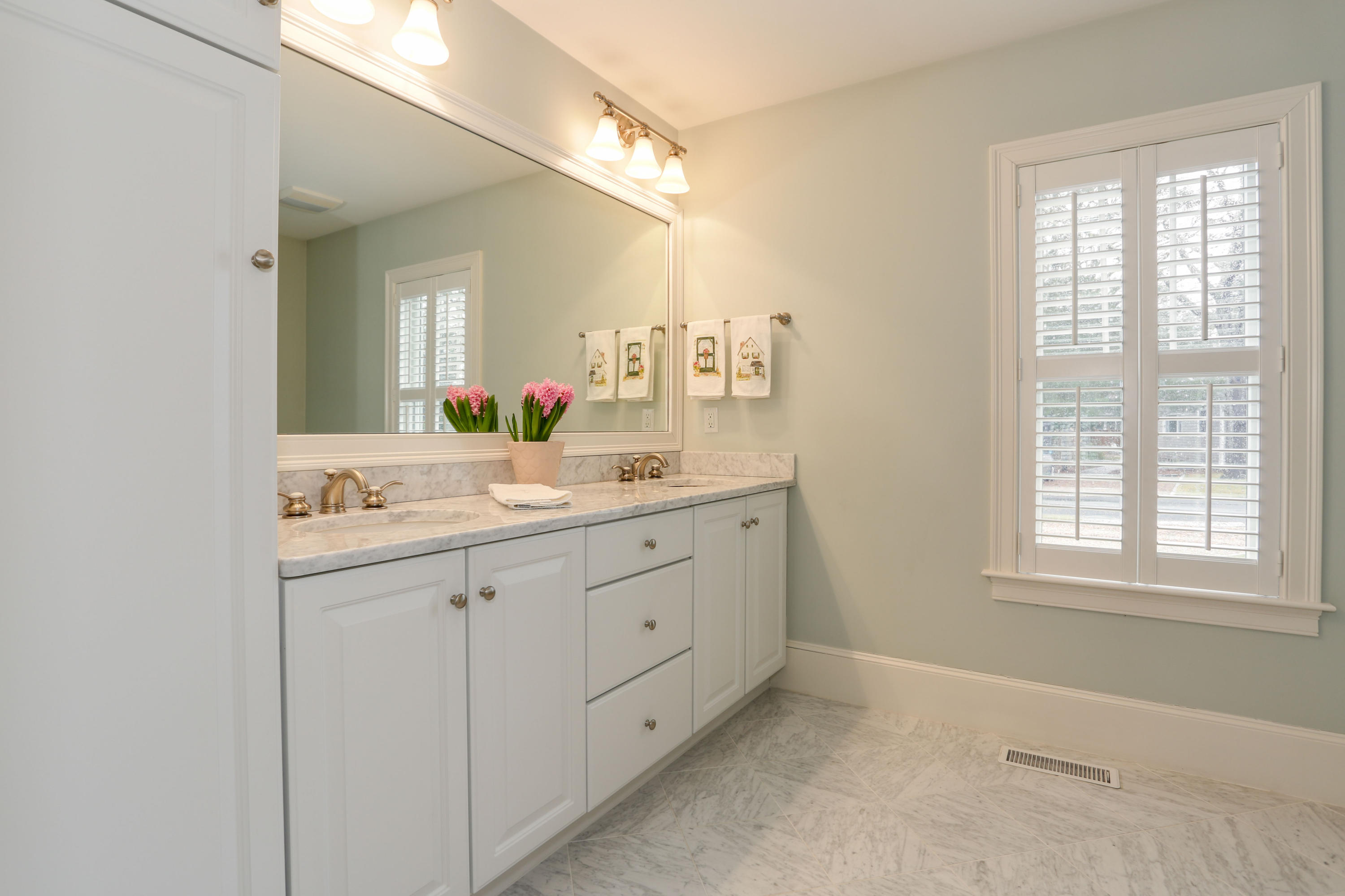 53 Blanid Road Osterville, MA 02655 - Photo 9 of 21 a bathroom with a sink a mirror and a vanity