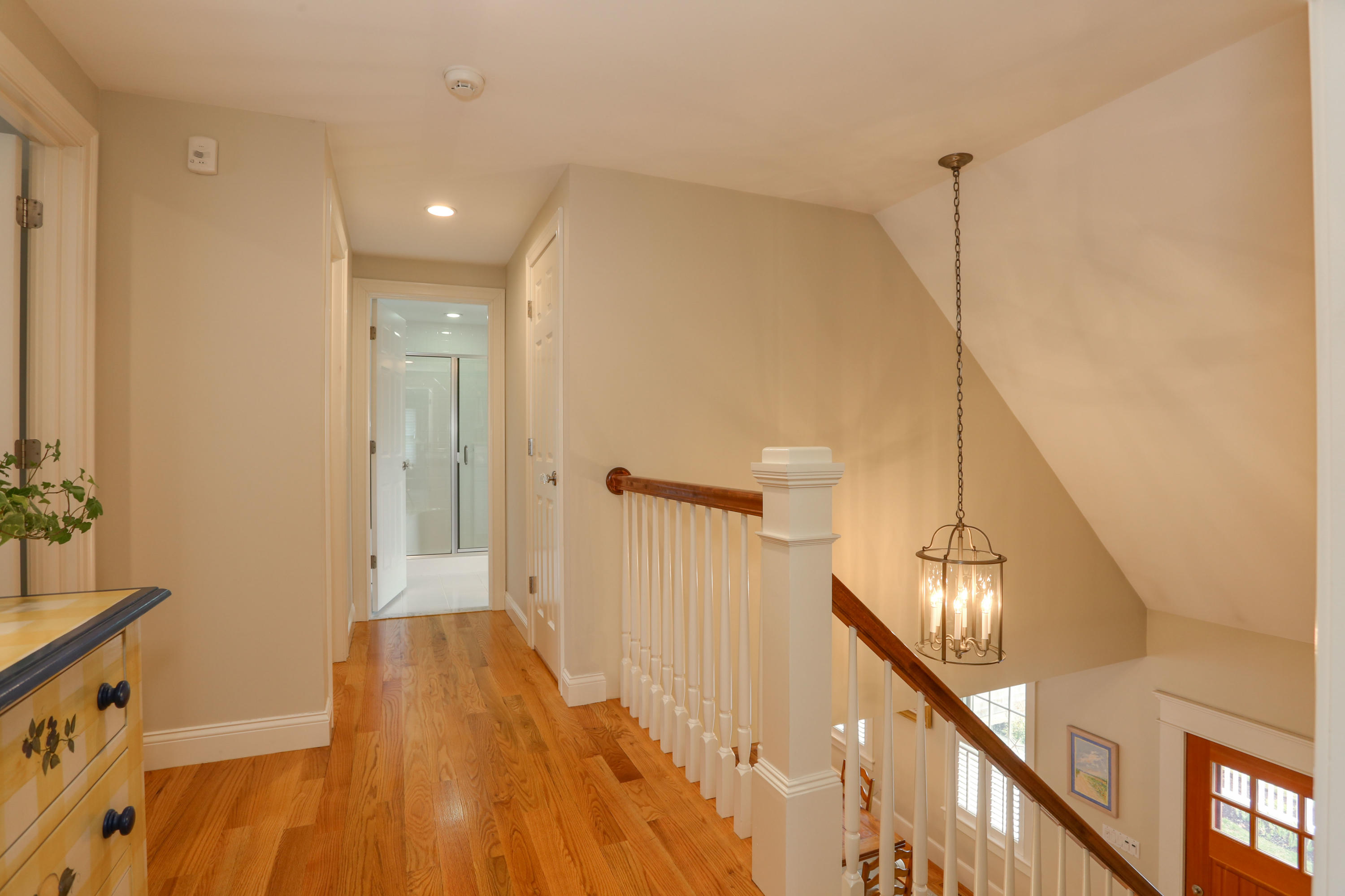 53 Blanid Road Osterville, MA 02655 - Photo 10 of 21 a view of a hallway with wooden floor and staircase