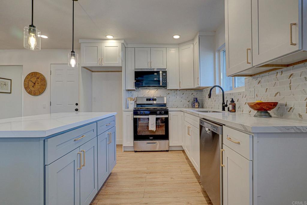 4205 Rene Drive San Diego, CA 92154 - Photo 11 of 29 a kitchen with granite countertop a sink and cabinets
