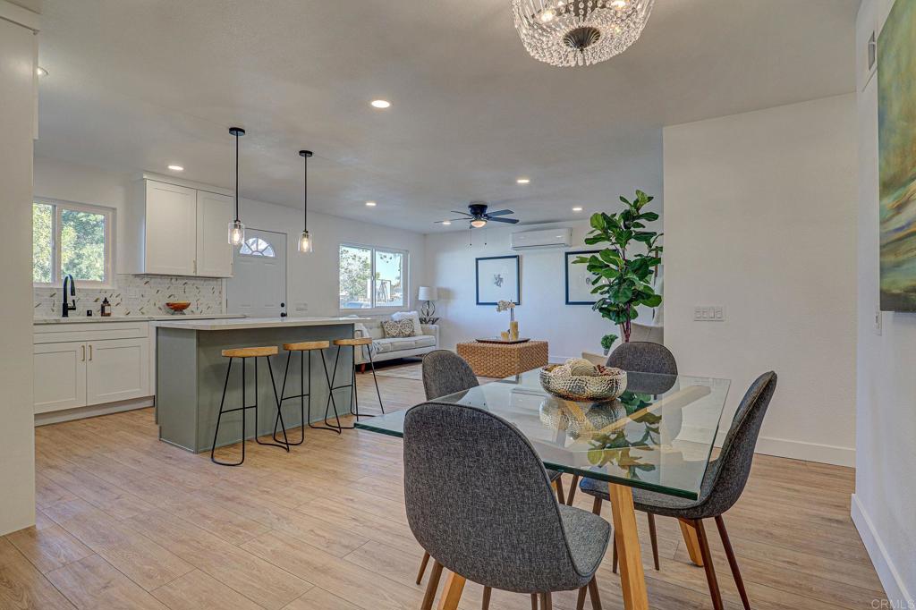4205 Rene Drive San Diego, CA 92154 - Photo 14 of 29 a dining room with furniture and wooden floor