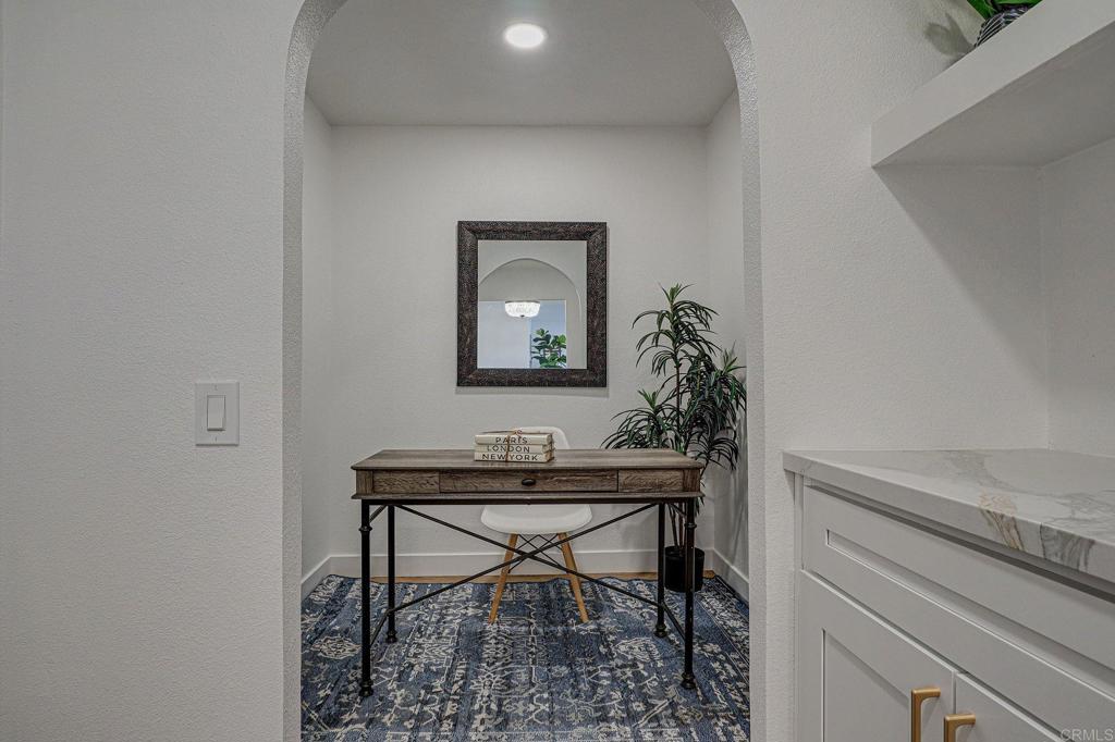 4205 Rene Drive San Diego, CA 92154 - Photo 17 of 29 a view of a workspace room with wooden floor and table