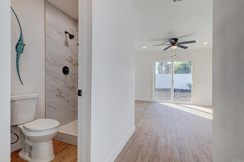 4205 Rene Drive San Diego, CA 92154 - Photo 18 of 29 a bathroom with a toilet a sink and shower