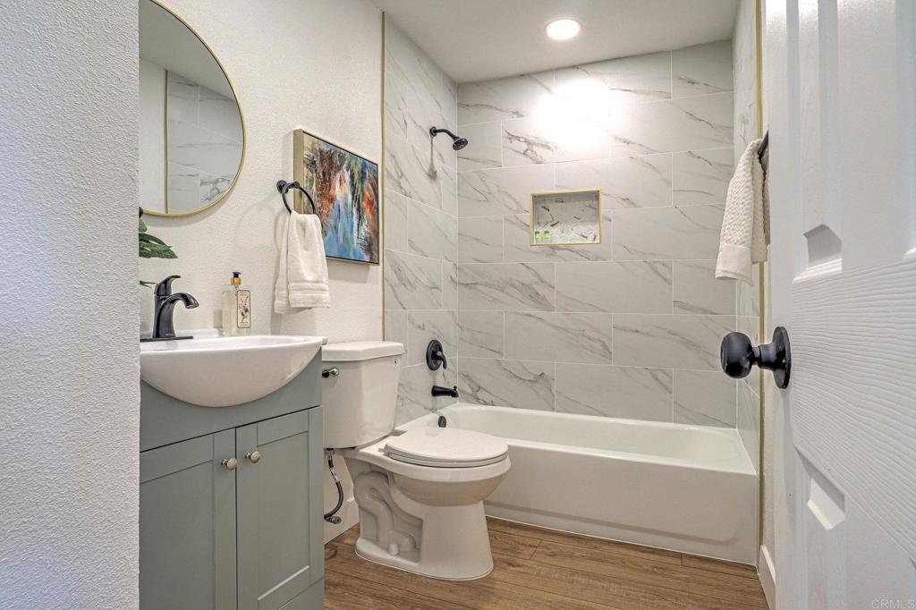 4205 Rene Drive San Diego, CA 92154 - Photo 21 of 29 a bathroom with a sink toilet and shower