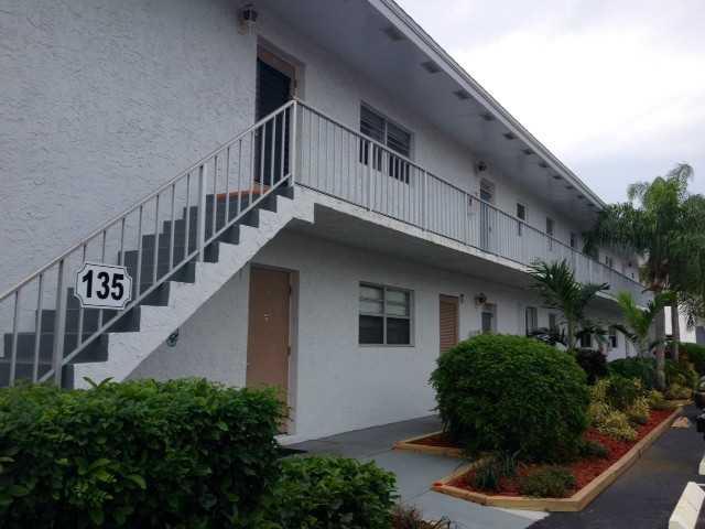 2950 Southeast Ocean Boulevard, Unit 1357 Stuart, FL 34996 - Photo 1 of 25 a view of a house with brick walls and windows